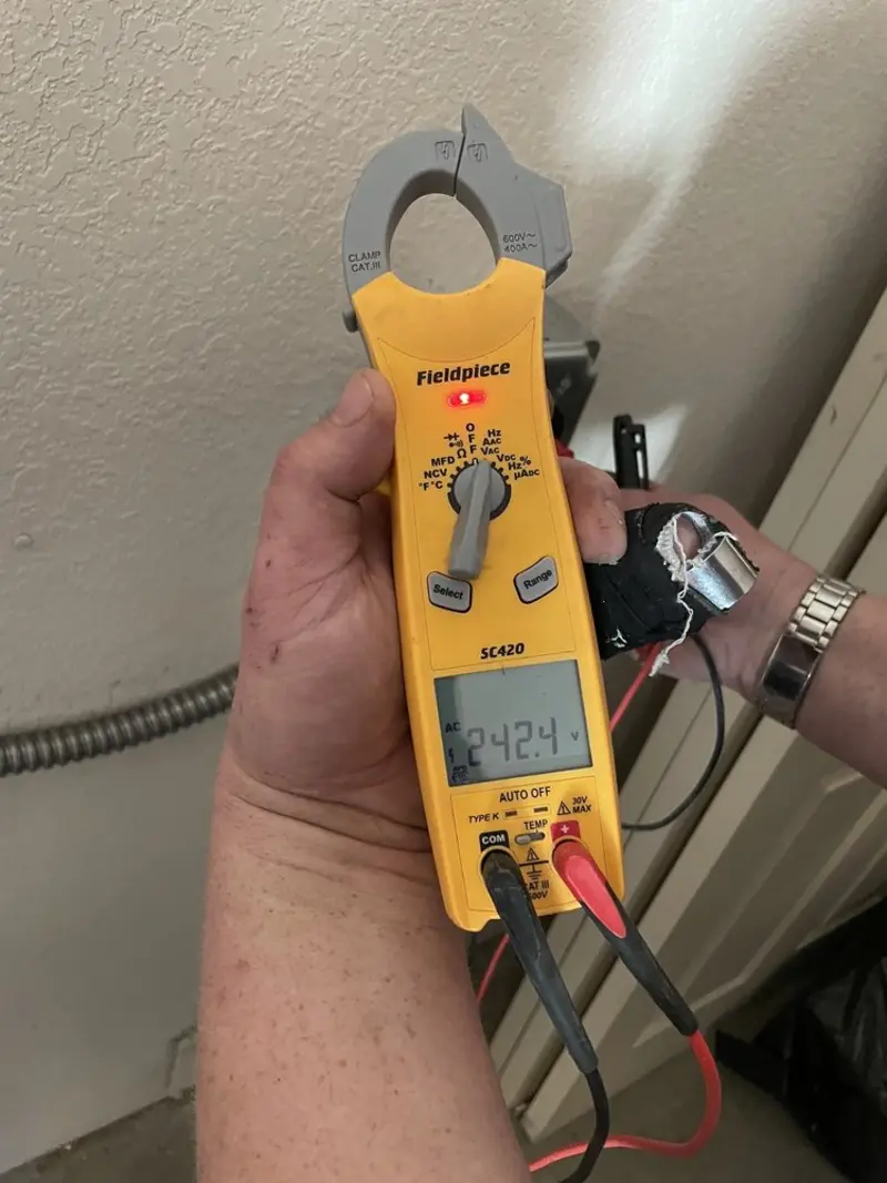 Voltage testing with clamp meter during Whole House Surge Protector in Monticello